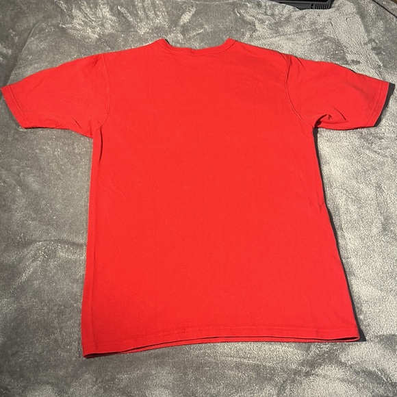 This is a champion shirt. True to its size, it’s a small. The color is red. - Picture 4 of 4